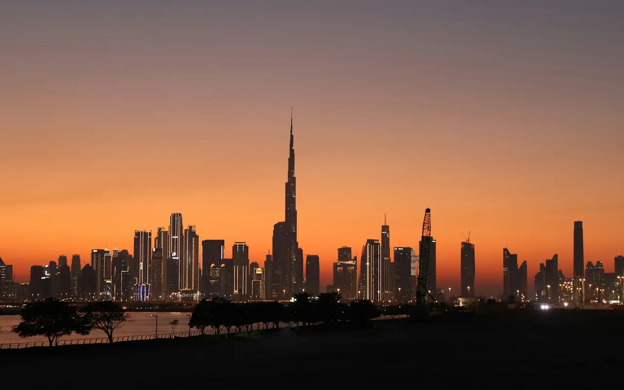 Downtown Dubai skyline and Burj Khalifa seen from Al Jaddaf at sunset