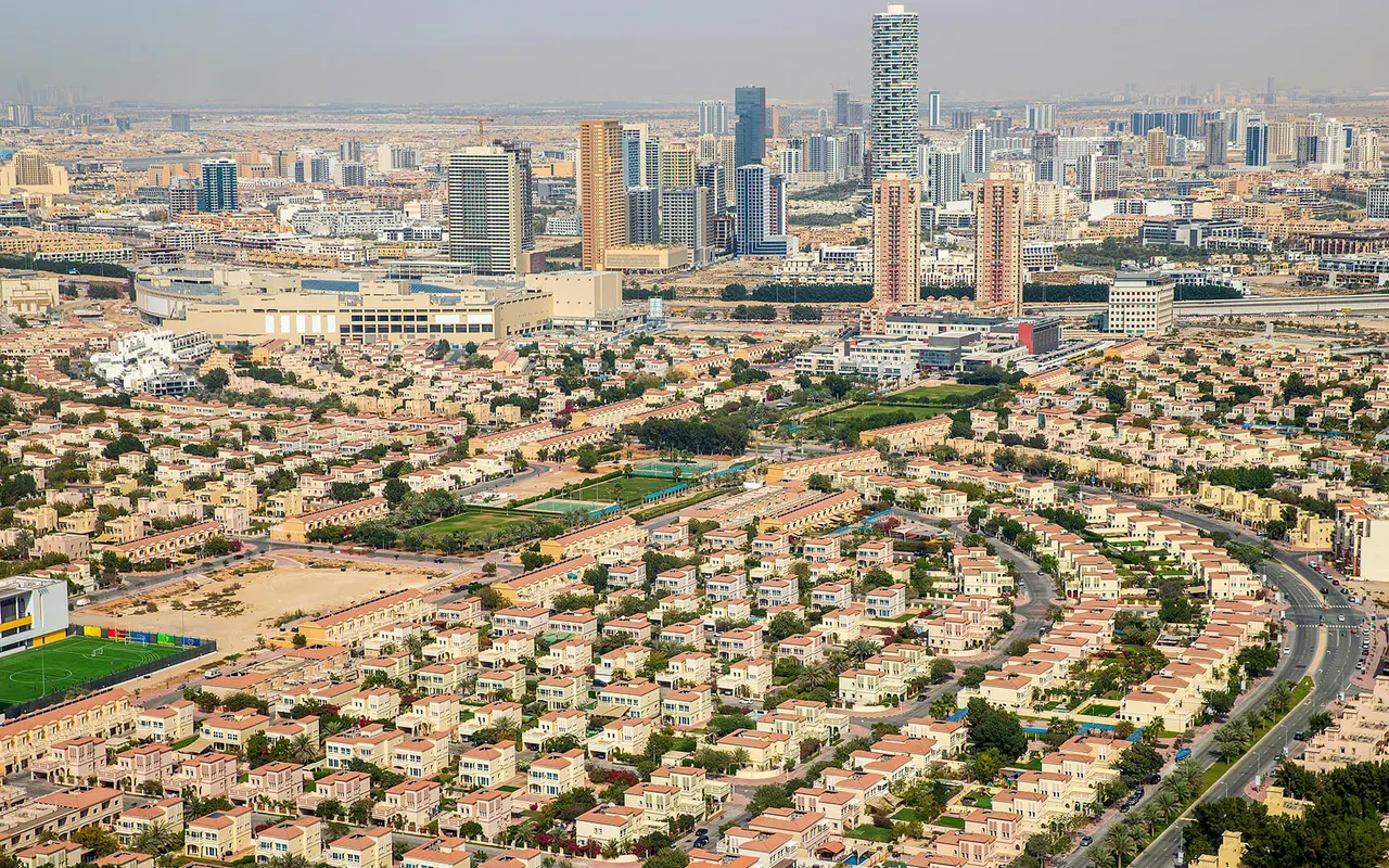 Aerial view of Jumeirah Village Triangle villas and surrounding apartment towers