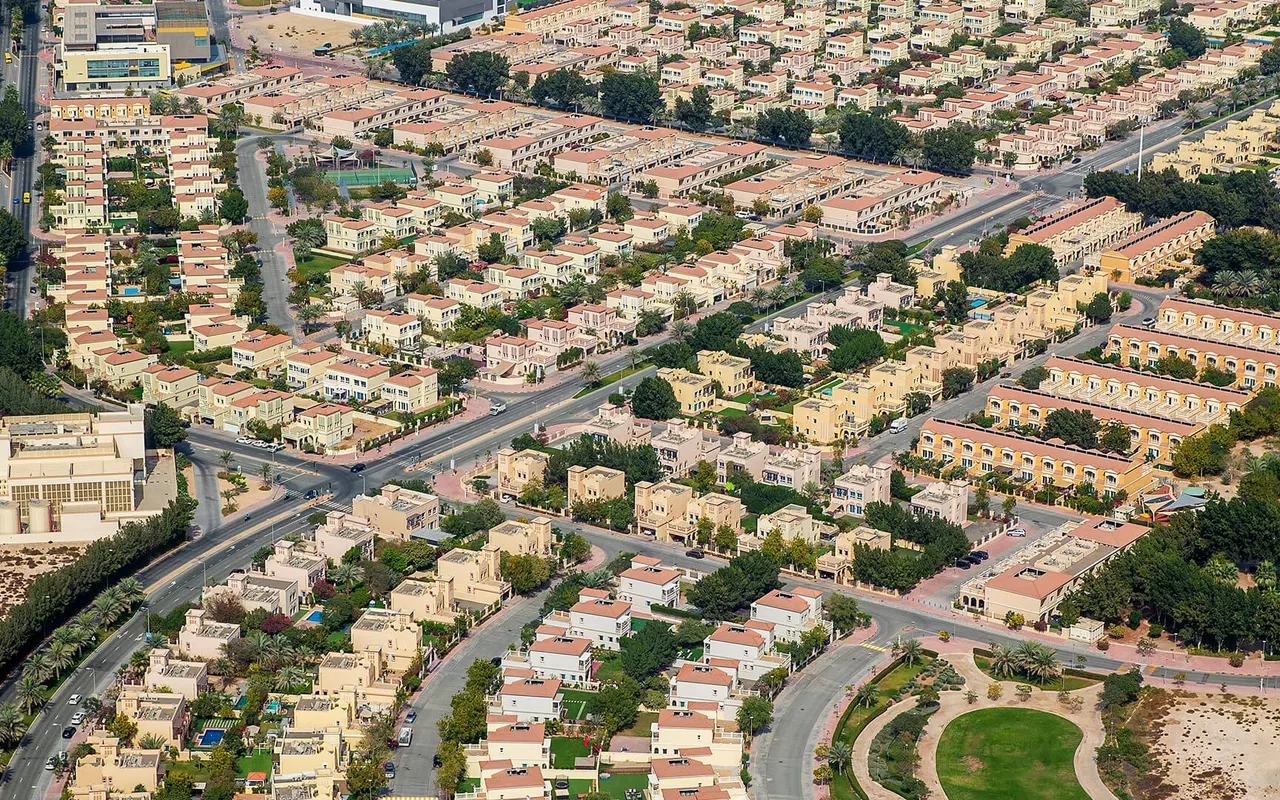 Jumeirah Village Triangle villa clusters and planted neighbourhood streets seen from above