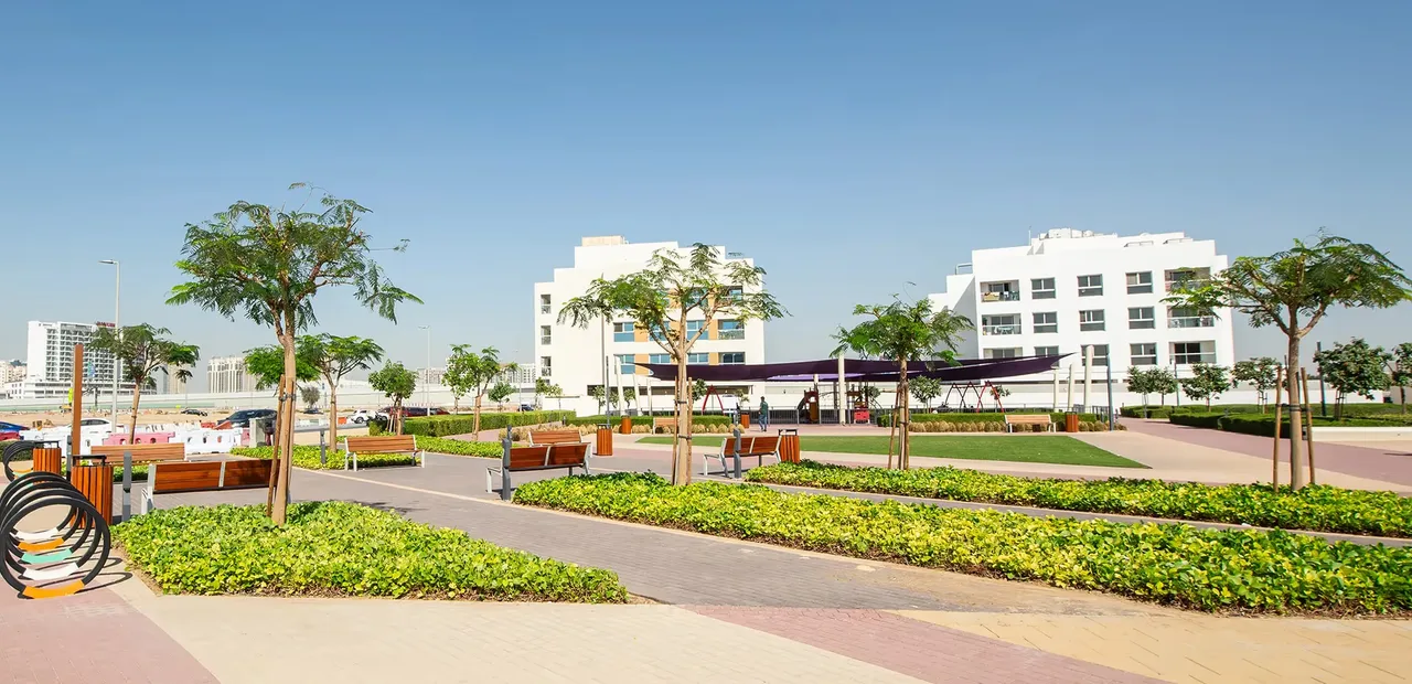 Completed residences and landscaped playground in Dubai Land Residence Complex