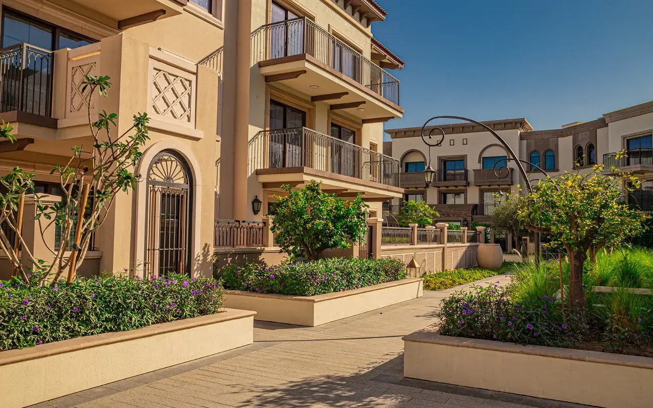 Completed residential facades and landscaped courtyard in Madinat Badr
