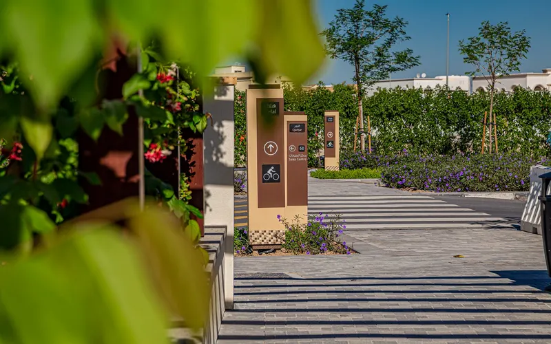 Flower-lined pedestrian path in Madinat Badr