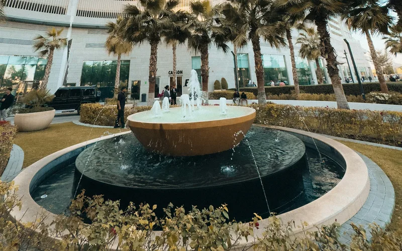 Fountain and palms outside Carson towers in DAMAC Hills